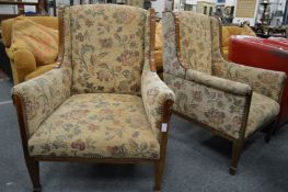 A pair of Edwardian inlaid mahogany armchairs.