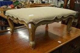 A decorative French style upholstered stool.
