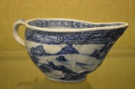 A small Chinese blue and white sauce boat.