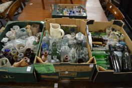 A good large collection of early bottles, jars, pot lids etc.