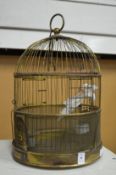 A brass bird cage.
