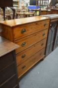 A satinwood four drawer chest.