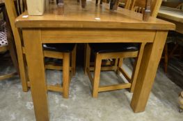Modern oak rectangular dining table with six ladderback chairs (some seat covers worn).