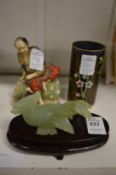 A carved jade bird, cloisonne brush pot and a satsuma figure.