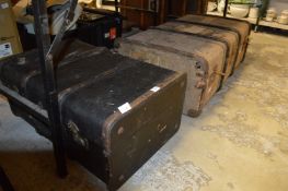 Two trunks, one containing old clothing.