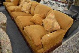 George Smith Limited, a three seater settee upholstered in a gold chenille fabric.