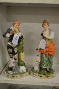 A pair of porcelain figurines.
