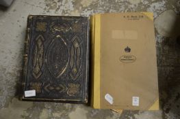 A Victorian family bible and an album of news cuttings.