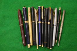 A small collection of fountain and other pens to include a silver propelling pencil.