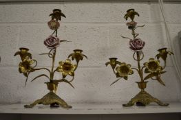 A pair of ornate floral candelabra with porcelain buds.