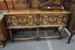 A Jacobian revival two drawer oak sideboard.