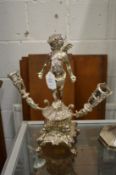 A plated centre piece base modelled as a standing cherub.