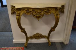 A giltwood and marble console table.