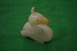 A carved jade duck.