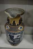 A large Chinese blue and white vase (rim missing a large piece).