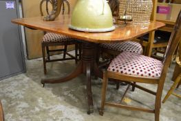 A mahogany tilt-top breakfast table.