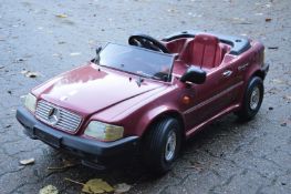 A battery operated children's Mercedes convertible.