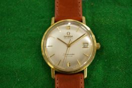 A gentlemen's Omega Seamaster De Ville gold plated automatic wristwatch with brown leather strap.