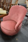A Victorian pink draylon upholstered nursing chair.