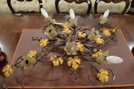 A decorative wrought iron light fitting.