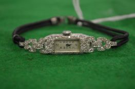A ladies' diamond set cocktail wristwatch.