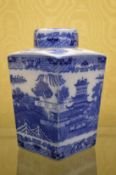 A Ringtons tapering square shaped blue and white tea caddy.