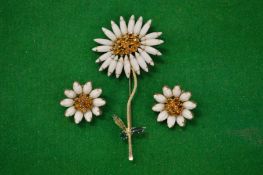 Decorative brooch and matching earrings modelled as flowers signed Weiss.
