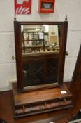 A George III mahogany dressing table mirror with three drawers to the base.