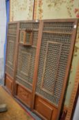 An Eastern mashrabiya work three panel dressing screen.