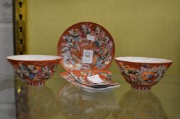 A pair of Kutani bowls and saucers.