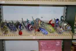A quantity of colourful Murano glass fish.