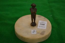 A miniature bronze figure of Napoleon on a marble base.