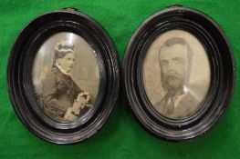 A pair of photographic portrait miniatures.