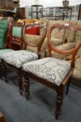 A pair of Victorian dining chairs.