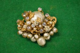 A designer brooch signed Dimario, New York.