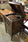 An HMV oak cased floor standing gramophone.