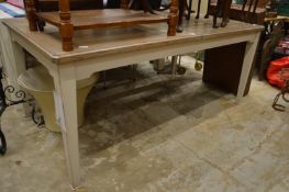 A large part painted extending oak dining table with two leaves.