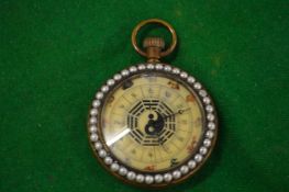 A decorative Chinese pocket watch with portrait enamel to one side, the dial with Chinese figures