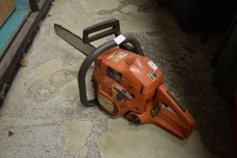 A Husqvarna 137 petrol chainsaw.