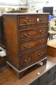 A small mahogany chest of drawers.
