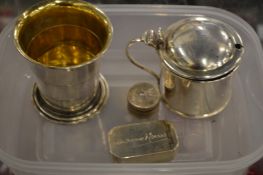 A silver mustard pot, collapsible silver beaker and other items.