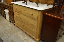 A pine three drawer chest.