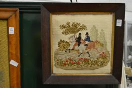 A woolwork picture of figures on horseback.