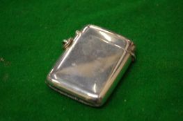 A plain silver vesta case.