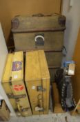 Two vellum suitcases, a pair of ski boots and an old trunk etc.
