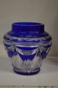 A Bohemian cut glass blue tinted vase.