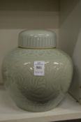 A Chinese Celadon jar and cover.