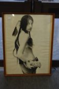 Female semi nude dressed as a native American, black and white photographic print.