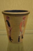 A beaker decorated with jockeys.