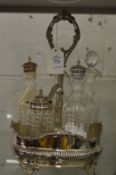 A plated five bottle cruet stand with cut glass cruets.